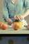 Woman squeezing oranges for juice