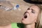 Woman squirting water from bottle