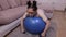 Woman on stability ball doing exercises for back