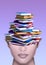 Woman with stack of books in the brain