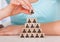 Woman stacking wooden team blocks at table