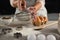 Woman staining flour in sieve