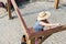 Woman staining a new wooden gazebo