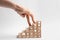 Woman and stairs made with wooden cubes on background, closeup. Health insurance concept