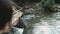 Woman stand on bridge over mountain river thailand