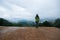 Woman standing alone wild mountains