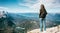 Woman standing in alp mountains peak, Karwendelspitze