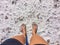 Woman standing on the beach in the tidal zone with the residual salt