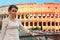 Woman standing on bridge near Colosseum