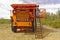 Woman standing by cab of large mining haul truck