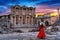 Woman standing in Celsus Library at Ephesus ancient city in Izmir, Turkey