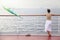 Woman standing on deck of cruise ship