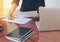 Woman standing at desk and working writing document hand close up.