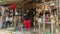 Woman standing at the door of her traditional Colombian crafts and sweets shop on the roadside