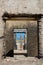 Woman standing in doorway of historic building