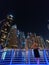 Woman standing at Dubai Marina street at night