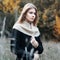 Woman standing in a field. autumn