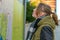 A woman is standing in front of a map looking for her target