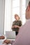 Woman standing in front of a window in an office