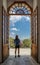 Woman standing gazing out doorway