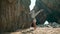 Woman standing hands practicing yoga on sand seashore. Girl training strength.