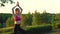 Woman is standing in a heron pose and looking forward while meditation.