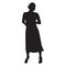 Woman standing. Long skirt, hands in pockets