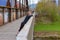 Woman standing looking out over a bridge parapet