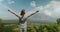 woman standing on lush green hillside