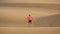 Woman is standing the Maspalomas sand desert