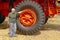 Woman standing by mine haul truck tire