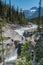 A woman standing at Mistaya Canyon in Summer sunny day, Alberta, Canada