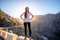 Woman standing on the mountain roadside