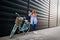 Woman standing near bike and making selfie