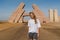 Woman standing near huge Gate of Allah, Ras Mohammed national park in Egypt. Desert