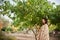 Woman standing near the lemon tree