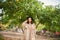 Woman standing near the lemon tree