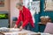 Woman standing near table folding clothes