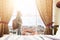 Woman standing near the window in hotel room