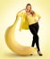 Woman standing next to a large banana