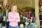 Woman standing outside florist