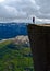 Woman standing on Pulpit Rock Preikestolen Norway