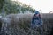 Woman standing in reeds in marshland of North Carolina State Park