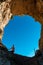 Woman standing in the rock formation Montepertuso Il Buco in Positano and Praiano, Amalfi Coast, Campania, Italy, Europe