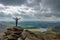 Woman standing on a rock formation overlooking a water reservoir