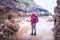 Woman Standing On The Rocky Beach In Rhossili Bay, Walesh Coast