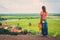 Woman standing on top of a hill enjoying Floating village view, Phnom Krom, Siem Reap, Cambodia