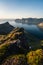 A woman standing on top of Husfjellet mountain peak in Senja island in summer season, Norway, Scandinavia