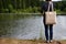 Woman standing with tote bag, mockup