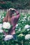 Woman standing Turn around to the garden Hydrangea flowers.